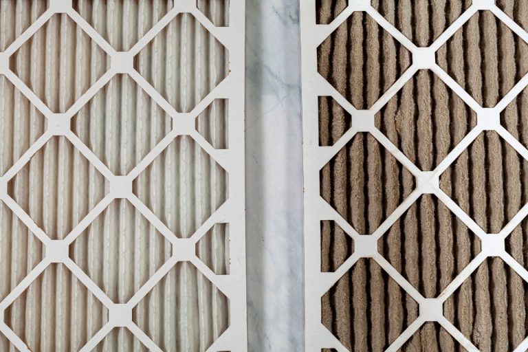 Side by side close up view of a new unused and an old heavily clogged dirty air filters